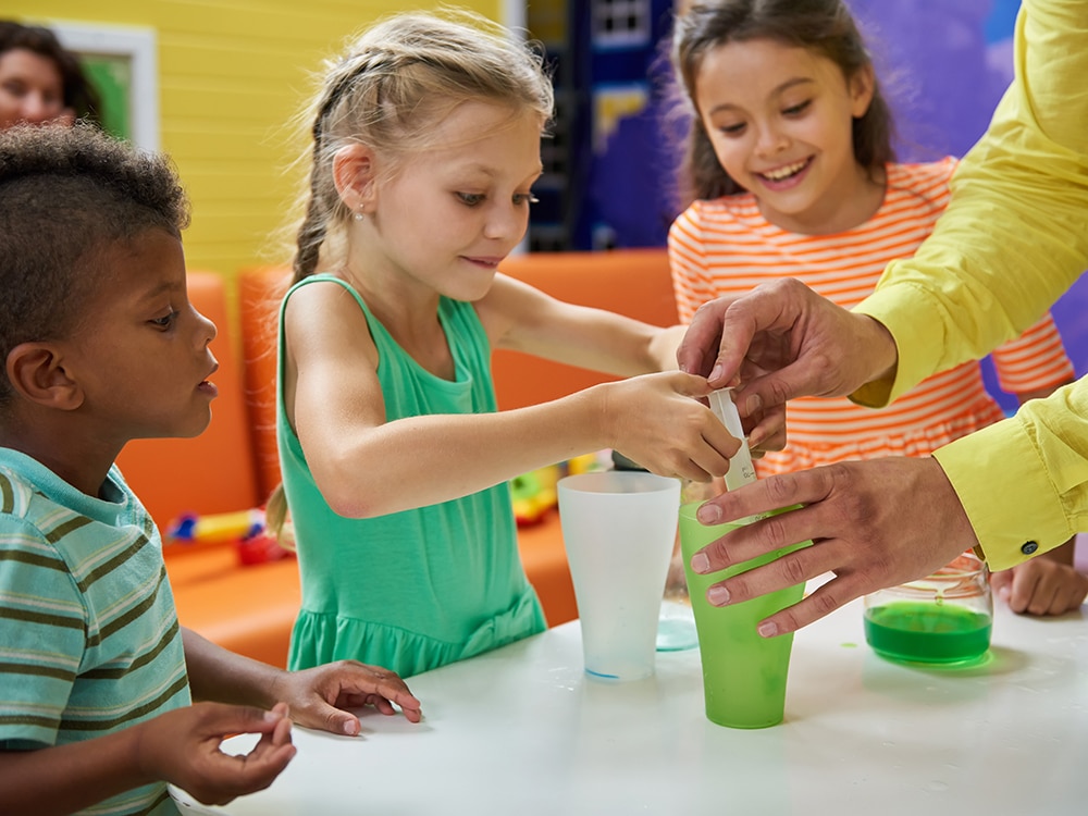 Children exploring a hands-on science activity at Spring Hill Day School